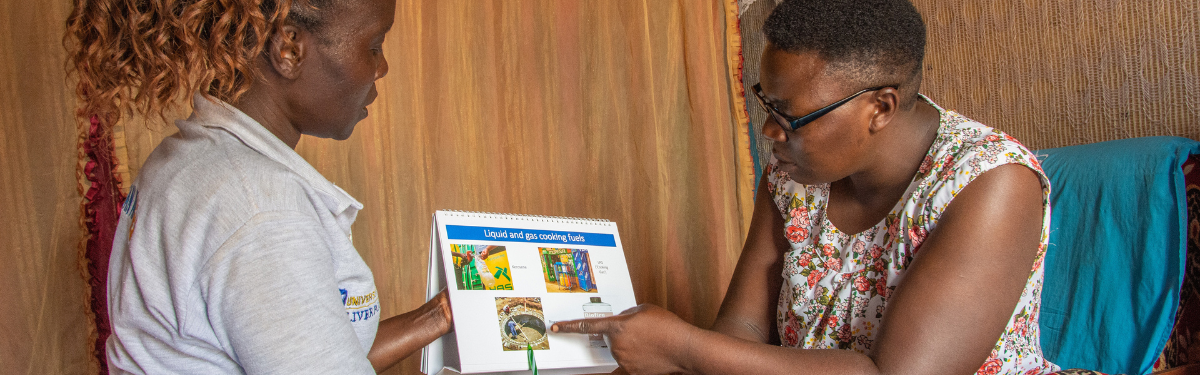 Trained Community Healthcare Provider giving preventative health information to a household in Kenya