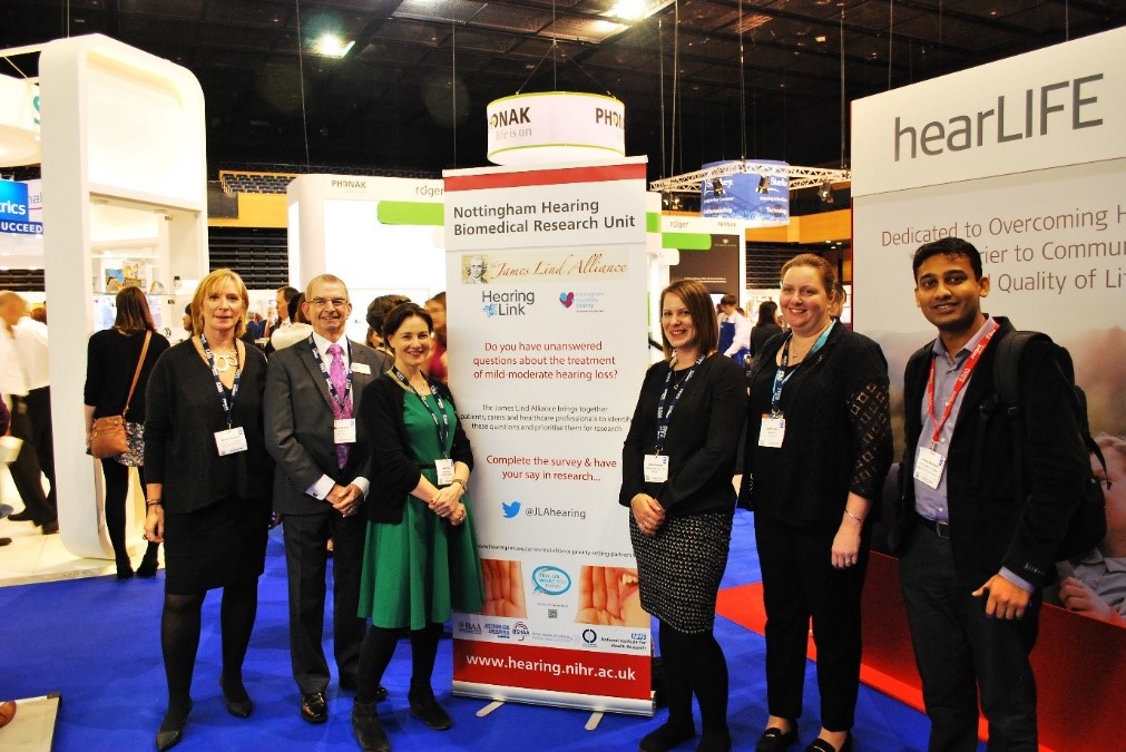 A group of people in front of a banner for the Nottingham Biomedical Research Centre