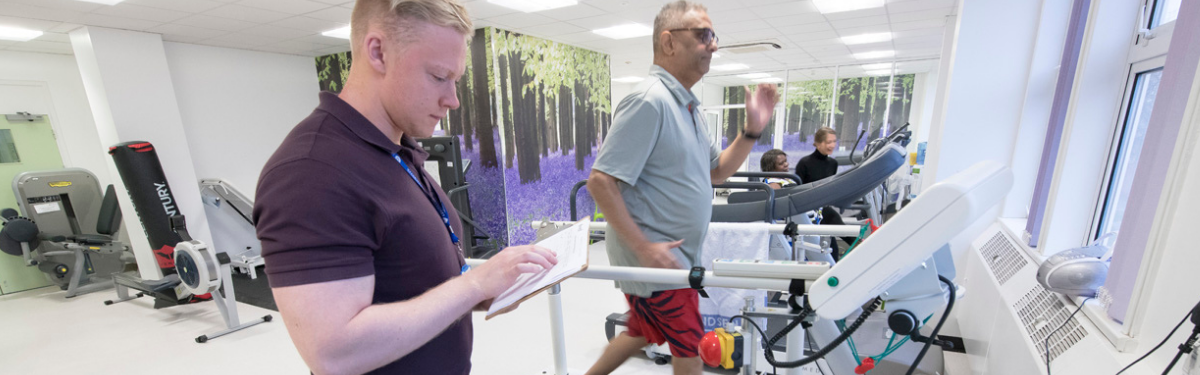 physician running tests on patient on treadmill