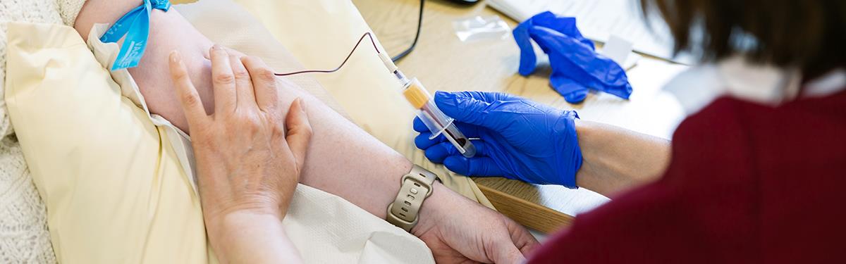 Photograph of nurse taking blood sample